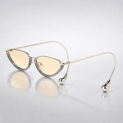 Halvra Cat-Eye Sunglasses — Transparent Gray Framed Champagne Slices (sunglasses hero)